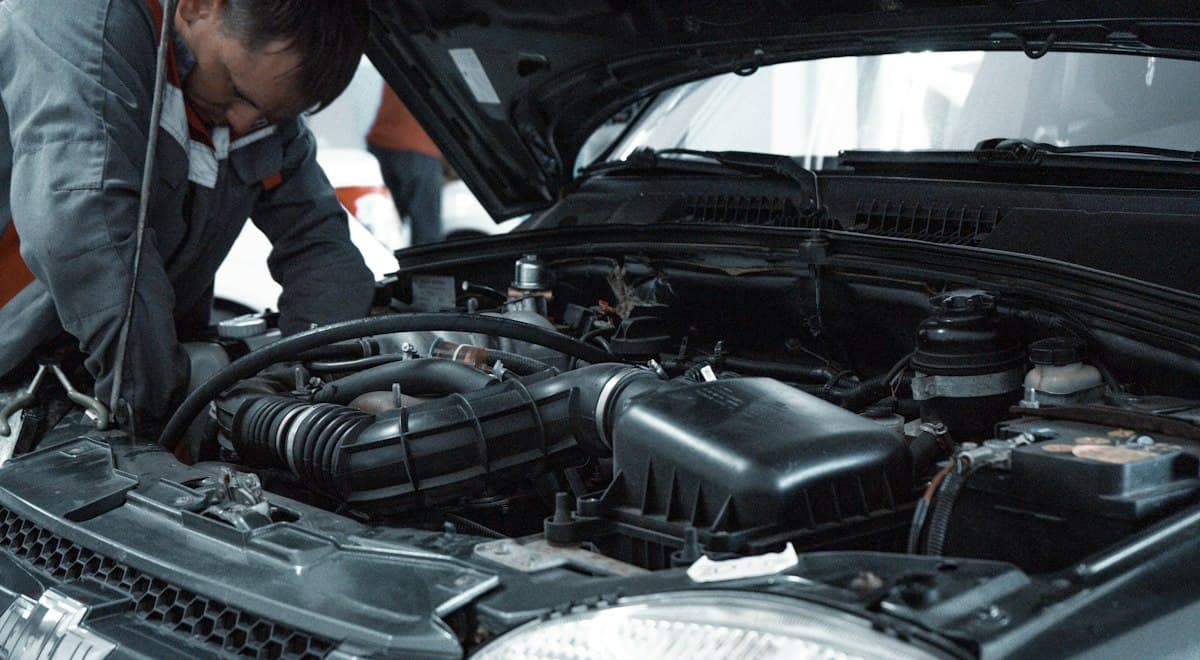 Mechanic working under the hood of a car